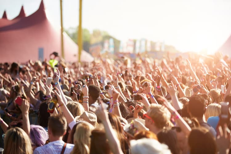 people at a music festival florida charter bus company