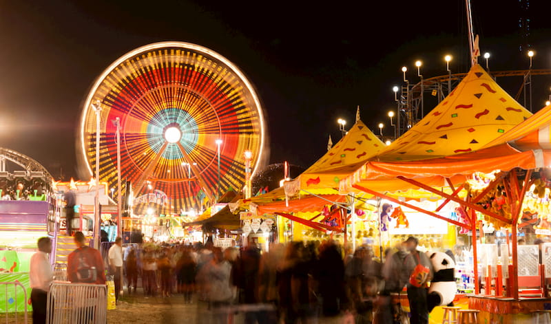 festival-goers enjoy carnival rides at the Fellsmere Frog Leg Festival