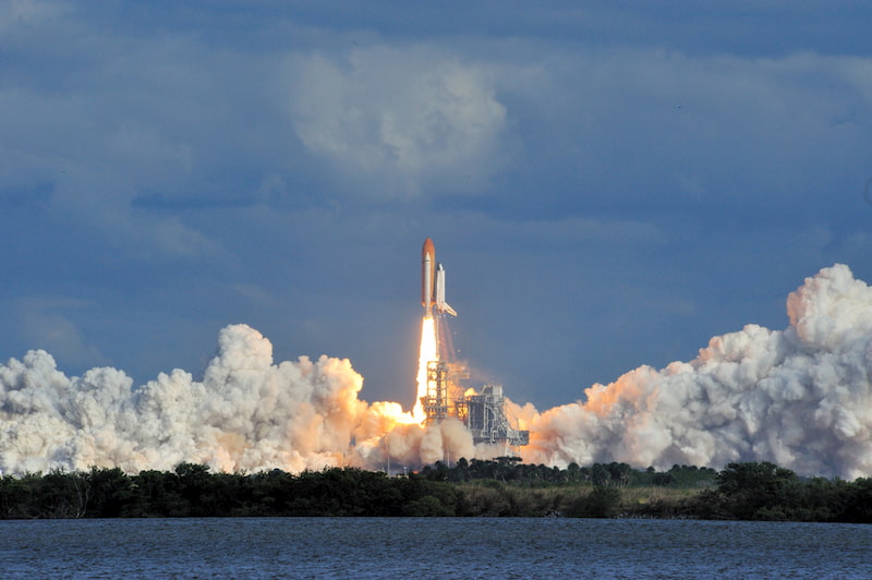 a rocket launches into space from the kennedy space center