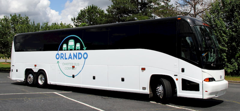 a charter bus from orlando charter bus company waits to begin a trip