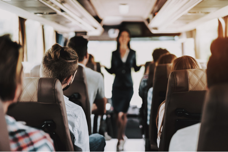 group seated on bus