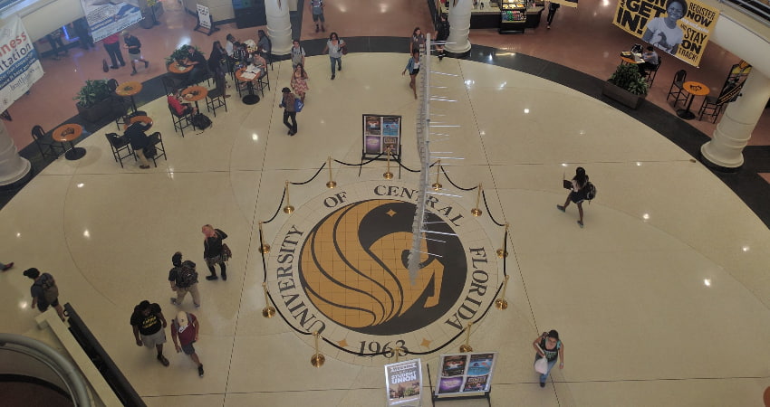 interior of the UCF student union with pegasus medallion in center of floor