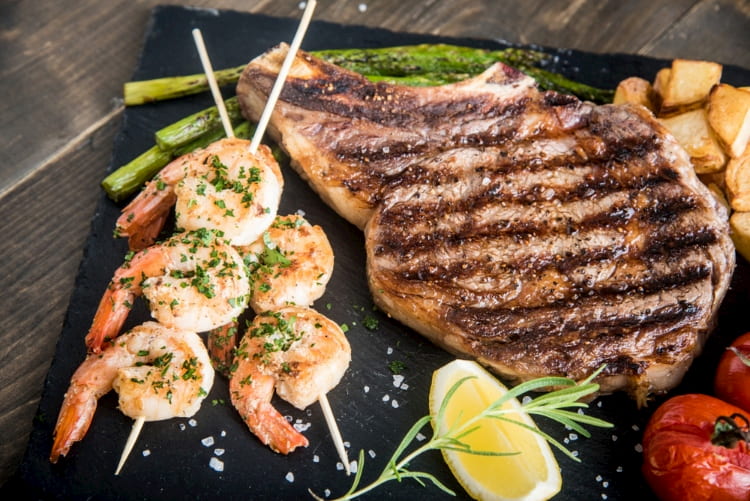 Surf and turf platter featuring steaks and shrimp