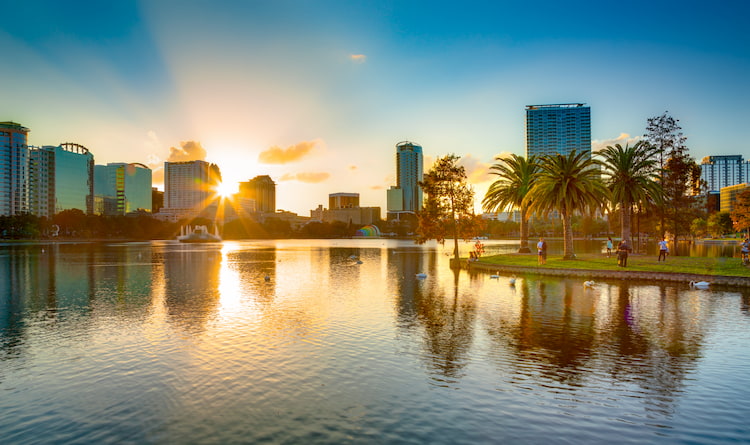 The Orlando city skyline over Lake Eola during sunset