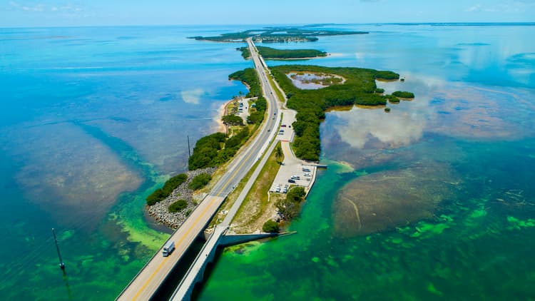 Florida key west highway surrounded by blue green water and islands