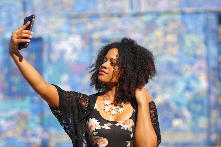 Woman taking selfie in front of Wynwood Walls