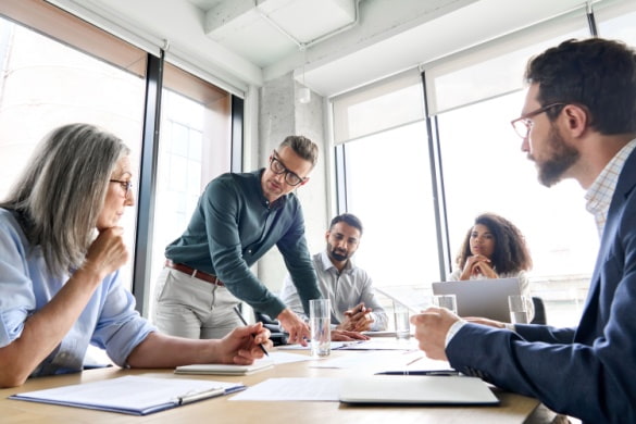 a group of employees discussing a business plan
